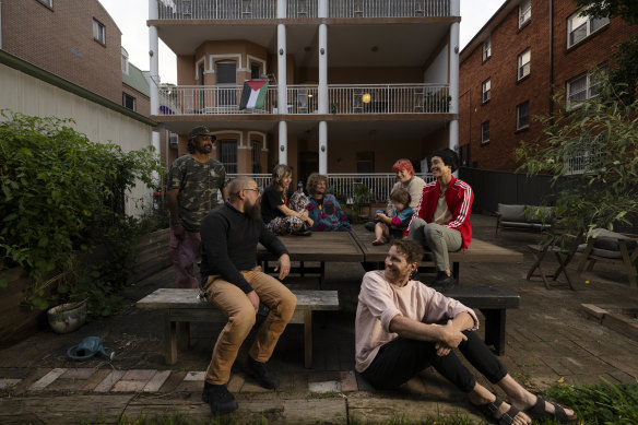 Kelly (front) and his group of friends, who bought a block of units, known as the “Peach Palace” together in Sydney.