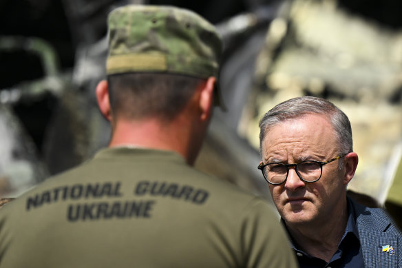 Australian Prime Minister Anthony Albanese speaks to members of the Ukrainian National Guard at Hostomel airport. 