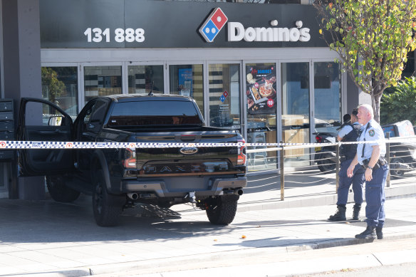 The Ford Ranger smashed into a Domino’s Pizza at Punchbowl during what police believe was an attempted abduction attempt.