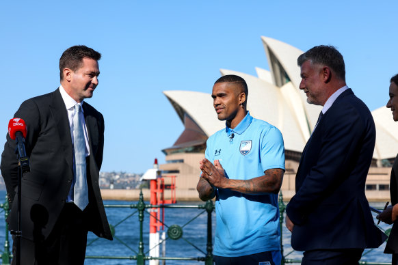 Sydney FC chairman Scott Barlow, Douglas Costa and coach Ufuk Talay.