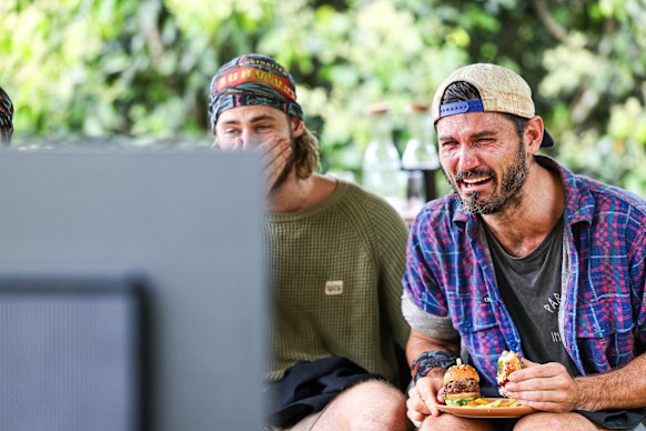 Simon reacts to a video of his wife and young daughter.