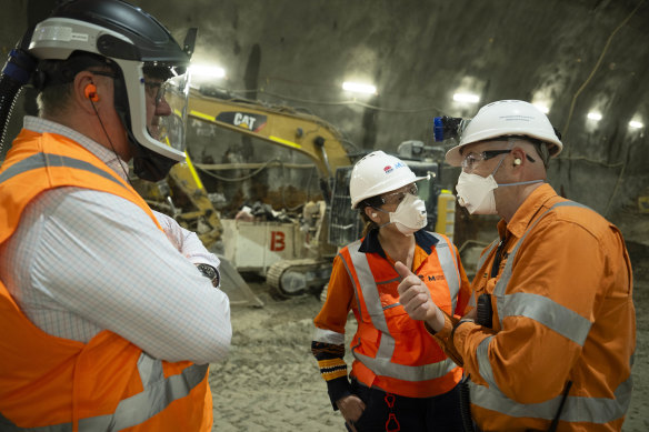 Project director Bob Nowotny, left, Sydney Metro head of project delivery Angela Jeffery and construction director Scott Connor in the Hunter Street station.