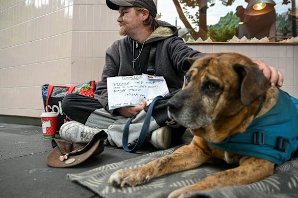Ashleigh and his support dog Tiger on the streets of Melbourne’s CBD.