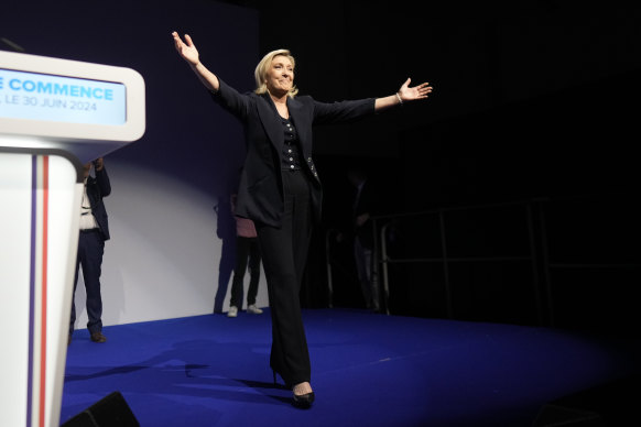 French far right leader Marine Le Pen gestures after delivering her speech after the release of polling projections.