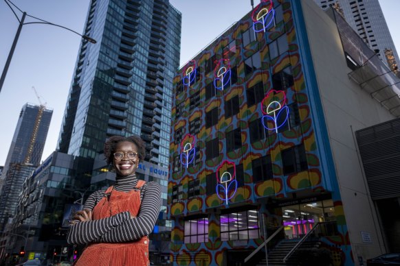 Atong Atem outside Hanover House, which has been transformed by her work  ‘Outdoor Living’, 2021. 
