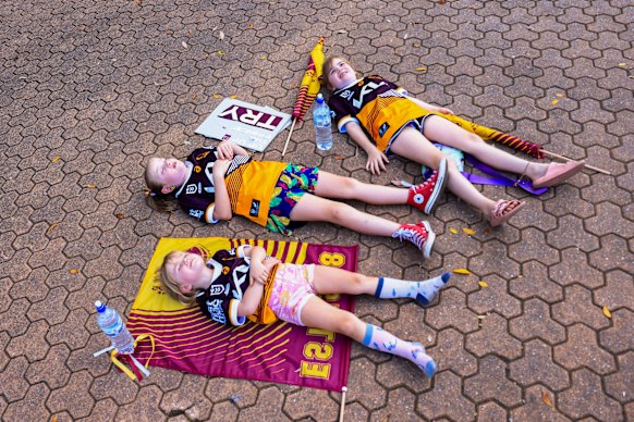 Broncos fans keep cool in the shade ahead of the 2023 NRL Grand Final at Accor Stadium, where temperatures hit 35.5 degrees.