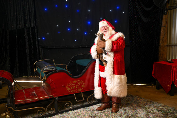 Aussie Santa prepares to for a photo shoot in his Santa Shed in Koo Wee Rup.