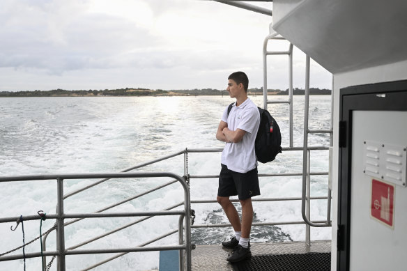 Samuel Alexander, 14, on the ferry from French Island that is part of his commute to school. 