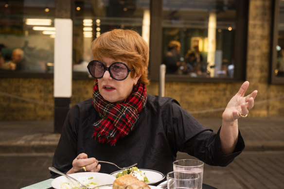Photographer Polly Borland knows the tricks of the trade as she is photographed at Ragazzi restaurant. She takes a red tartan scarf out of her handbag like she’s pulling a rabbit out of a hat.