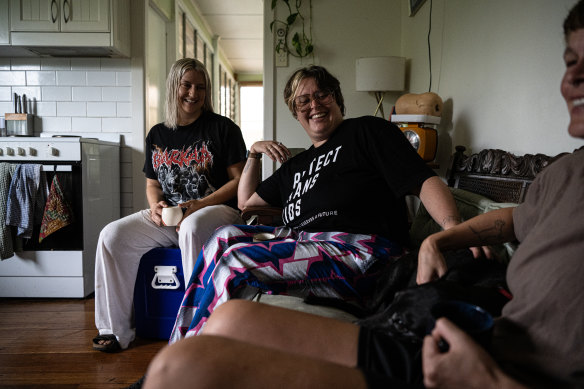 Lismore local AJ Jensen (centre) helped people evacuate on Thursday night. 