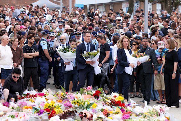 NSW Premier Chris Minns laying flowers outside Bondi Pavilion on Monday.