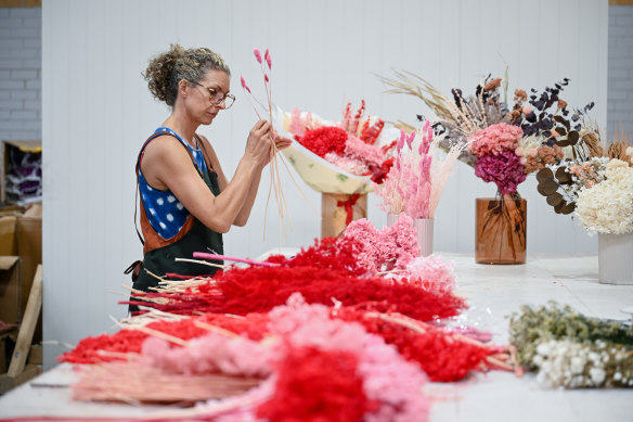 Everbloome’s Tracey McPherson prepares flowers for Valentine’s Day.