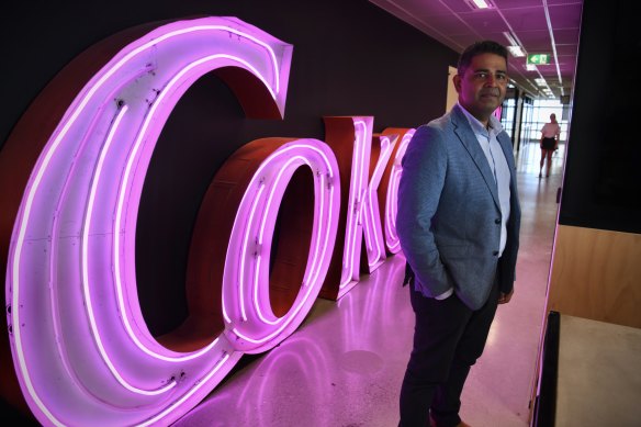 Coca-Cola’s Australia boss Orlando Rodriguez in front of part of the old Coca-Cola sign from Williams Street, Kings Cross. 