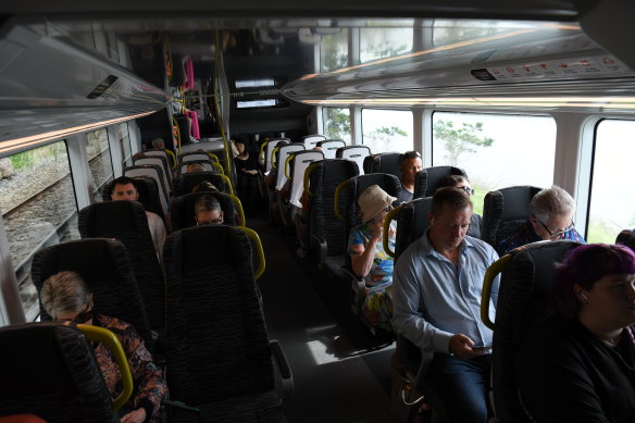 Passengers onboard a new Mariyung train operating between Newcastle and Sydney.