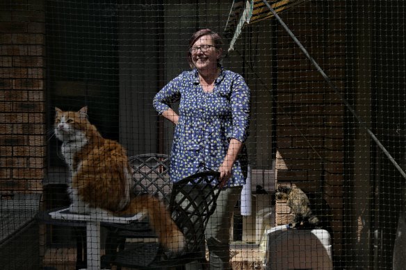 Ondine Evans has constructed an outdoor cat pen for her two cats, Butternut and Biscotti, so they are not a threat to local wildlife.