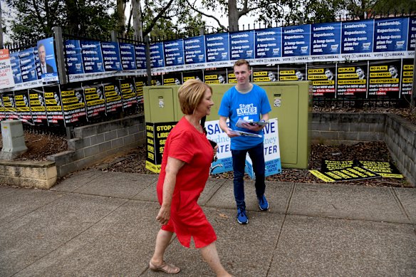 Labor candidate for the seat of Penrith Karen McKeown, in red, arriving at Samuel Terry Public School in Cranebrook this afternoon.