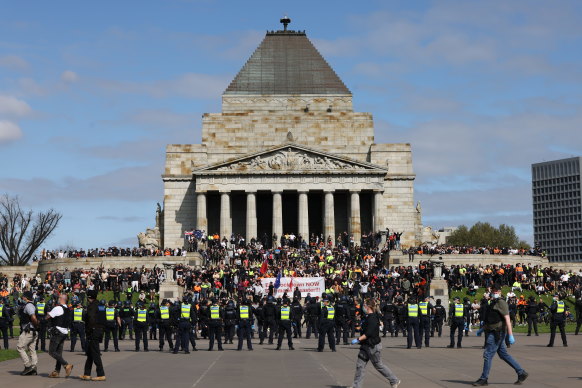 Police surround protesters at the Shrine of Remembrance.
