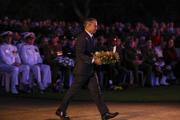 WA Premier Roger Cook walks out to lay a wreath.