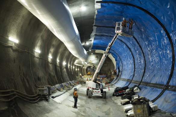 Workers install lining to tunnels in the Hunter Street station.
