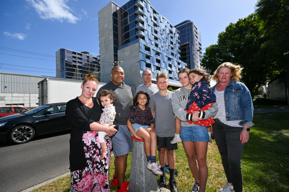 Alison Bacon (far right) with her family and other Fishermans Bend residents near the corner of Plummer and Prohasky streets.