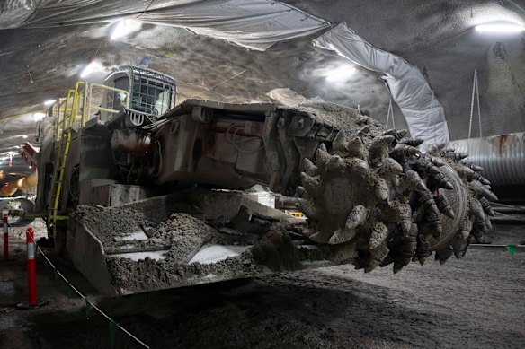 Excavation equipment known as road-headers are being used to carve out massive caverns to assemble the tunnel boring machines. 