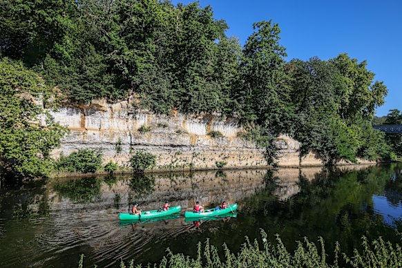 People canoe along the Vezere.
