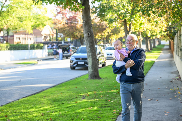 Michael Coates and his granddaughter at school drop-off time on Tuesday morning near Caulfield Grammar in Glen Iris. 