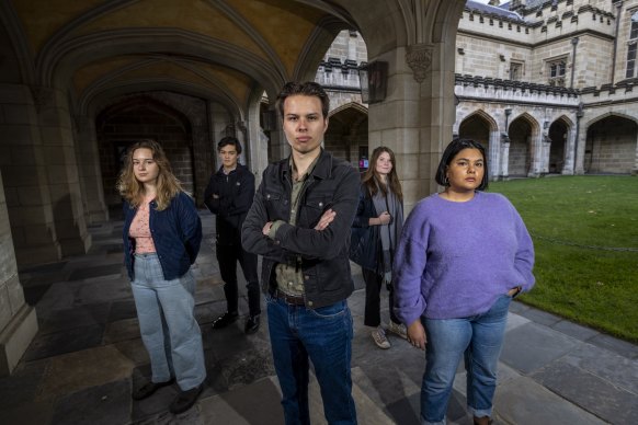 Melbourne University student union president Jack Buksh (centre) is leading the movement against the Liberal-backed institute.