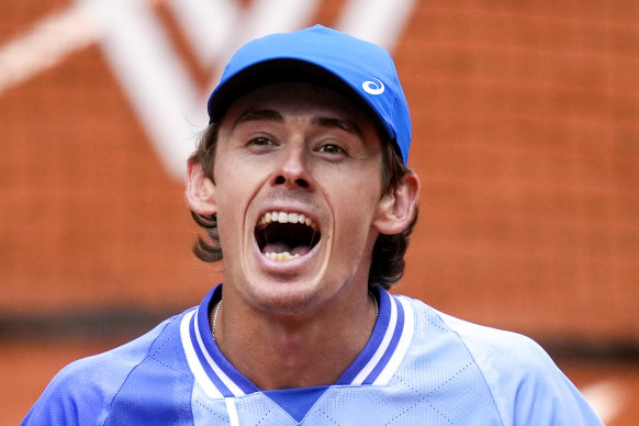 Alex De Minaur celebrates winning his fourth round match of the French Open tennis tournament against Russia’s Daniil Medvedev.