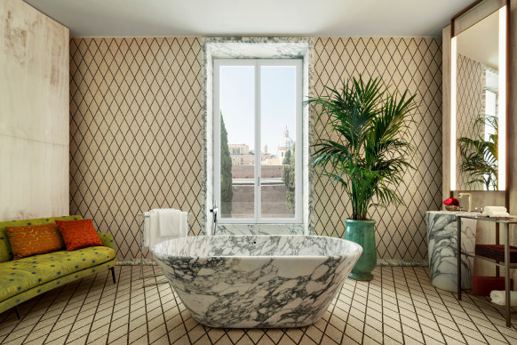 Views of Rome from the Corchia marble bath tub in The Bulgari Suite.