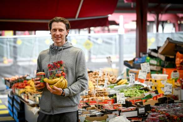 Ukrainian Dmitro Savin shops for fruit and vegetables in Melbourne on Thursday.