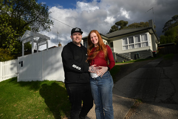 Melissa and Scott Russell outside their Diamond Creek home.