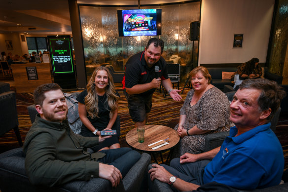 Julie Klancic (second from right) and her family members, Stuart Corstorphan, Kira Corstorphan and Brian Corstorphan, with the Quiz Master Matt Gridley (standing) at pub trivia in Ringwood.