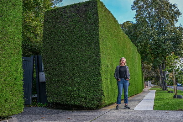 Lynne recently paid to extend the footpath in front of her home to save 100-year-old cypress hedge. 