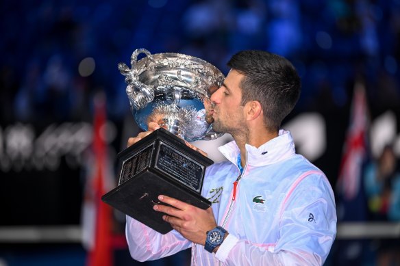 Novak Djokovic gets his hands on the Australian Open trophy for the 10th time.