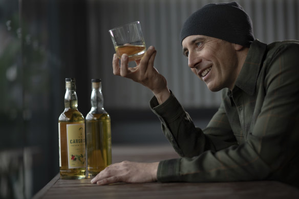Master Distiller at Sydney Rum Distillery Jonny Croft, samples some local rum. 