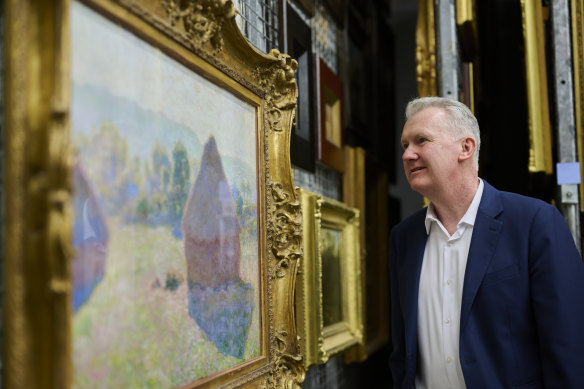 Minister for Arts Tony Burke with Claude Monet’s, Meules, milieu du jour [Haystacks, Midday] at the National Gallery of Australia.
