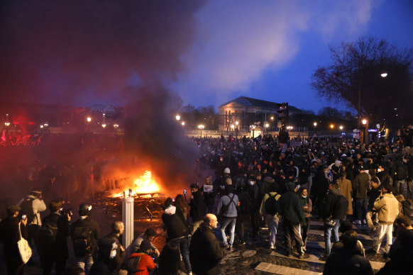 Pallets burn as protesters demonstrate at Concorde square in Paris.