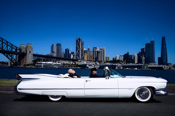 Sandilands on Sydney Harbour in a 1959 Cadillac convertible, pictured for a 2023 AFR Magazine cover story on the rise of the “schlock jock”.
