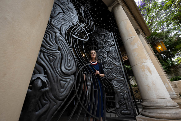 Public arts consultant Barbara Flynn with the work by artist Badger Bates, at Yirranma Place, in Darlinghurst.