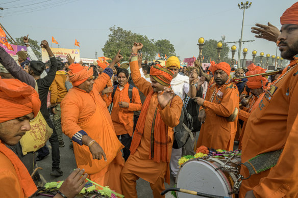 Devotees celebrate the day before the inauguration of the Ram temple in Ayodhya, India.
