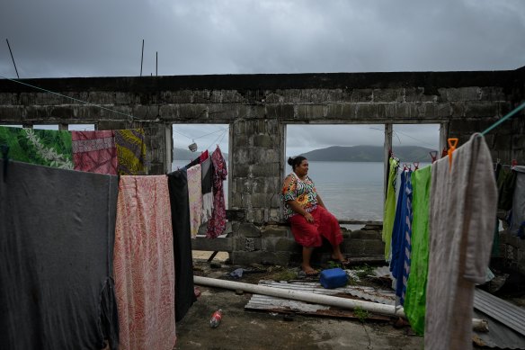 Esther Telupe at her uncle’s Kioa house on the beach, next to her home. Construction was abandoned when it became clear it would be affected by sea level rise.