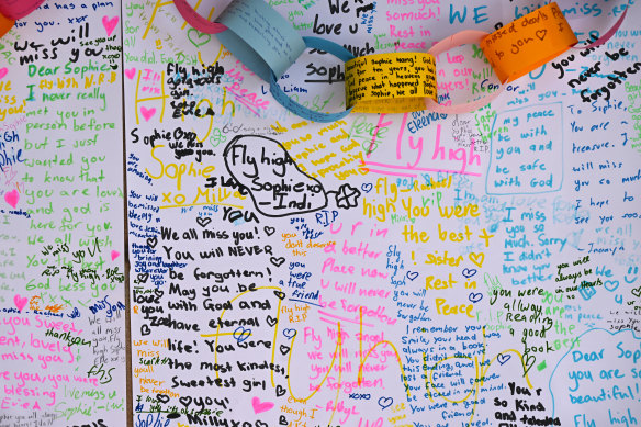 Messages from the school friends of schoolgirl Sophie Wang are seen at a memorial at Emmanuel College at Emerald Lakes.