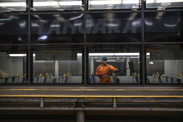 A Sydney trains cleaner on a Tangara at Mortdale Depot. 