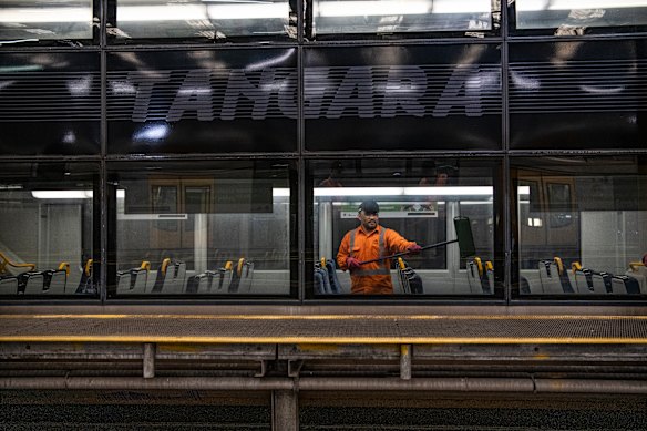 A Sydney trains cleaner on a Tangara at Mortdale Depot. 