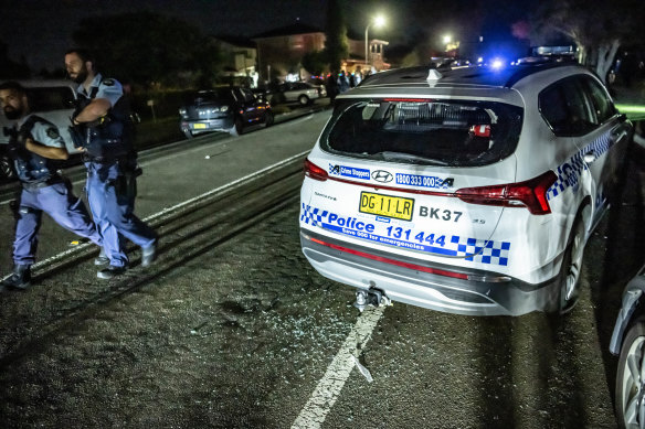 Police cars were damaged in the riot.