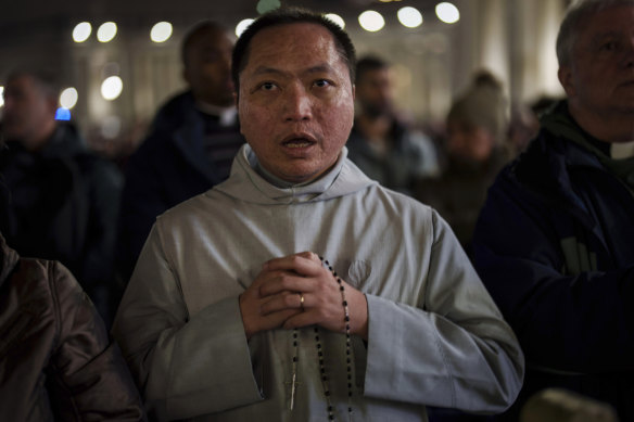 A Catholic priest at a prayer of the Rosary for Pope Francis, in St Peter’s Square at The Vatican.