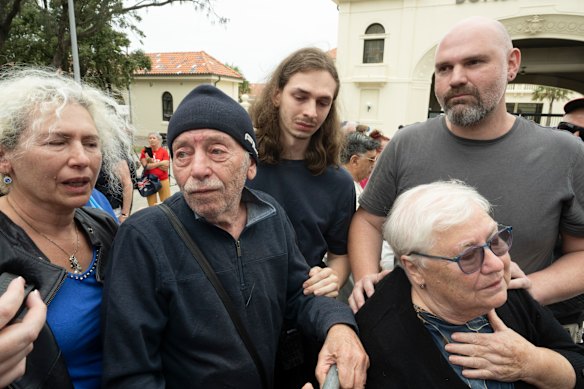 The family (aunt, grandfather, cousin, cousin, and grandmother) of Matilda gather with mourners in Sydney.