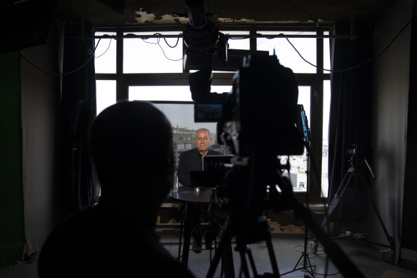 Palestinian politics analyst Nehad Abu Ghoush broadcasting from inside the network’s office in the West Bank city of Ramallah.