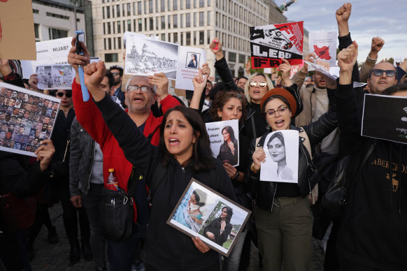 Protesters gather in Berlin, Germany, to demonstrate against the death of Mahsa Amini in Iran.